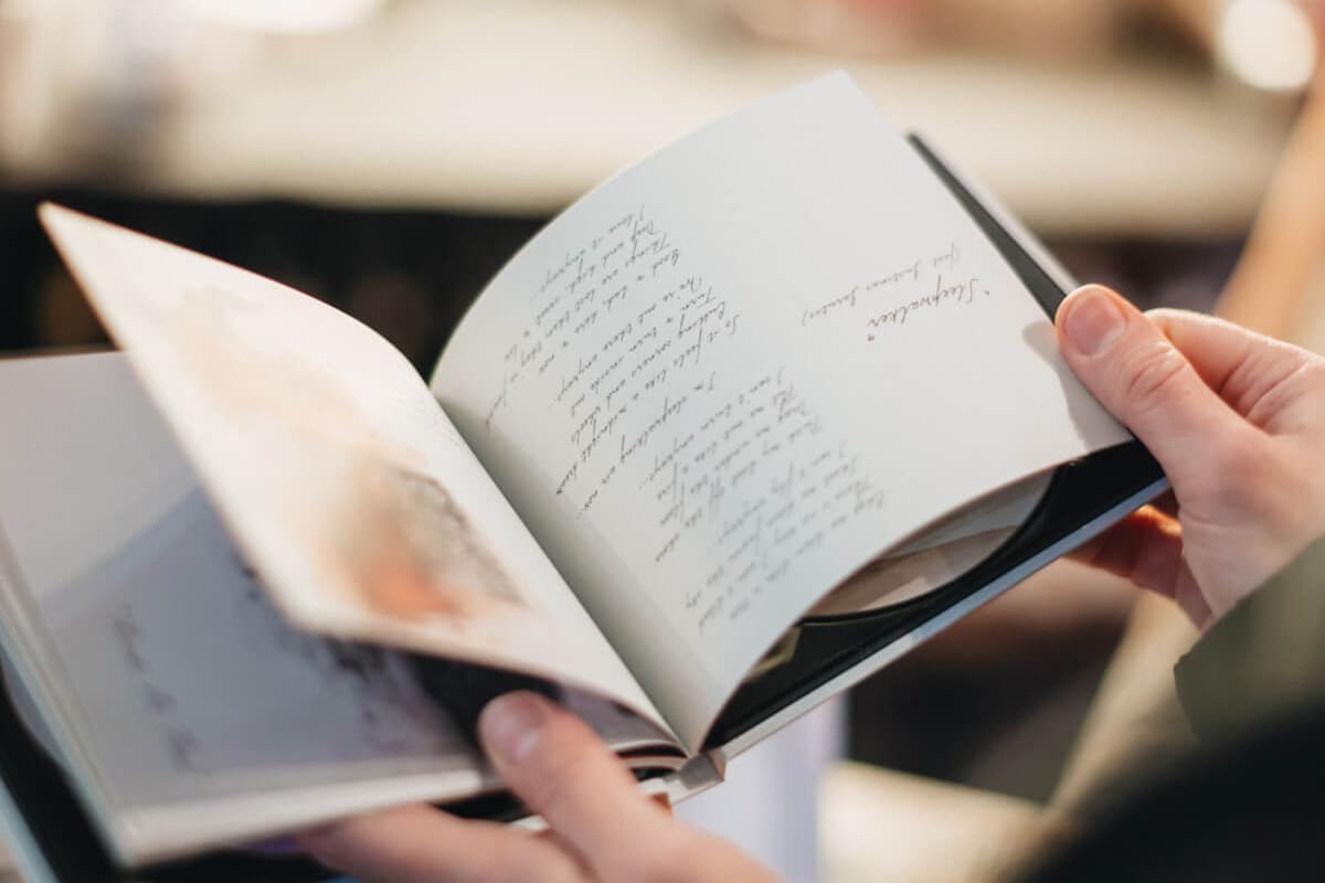 Someone flipping through a book book-17@2x